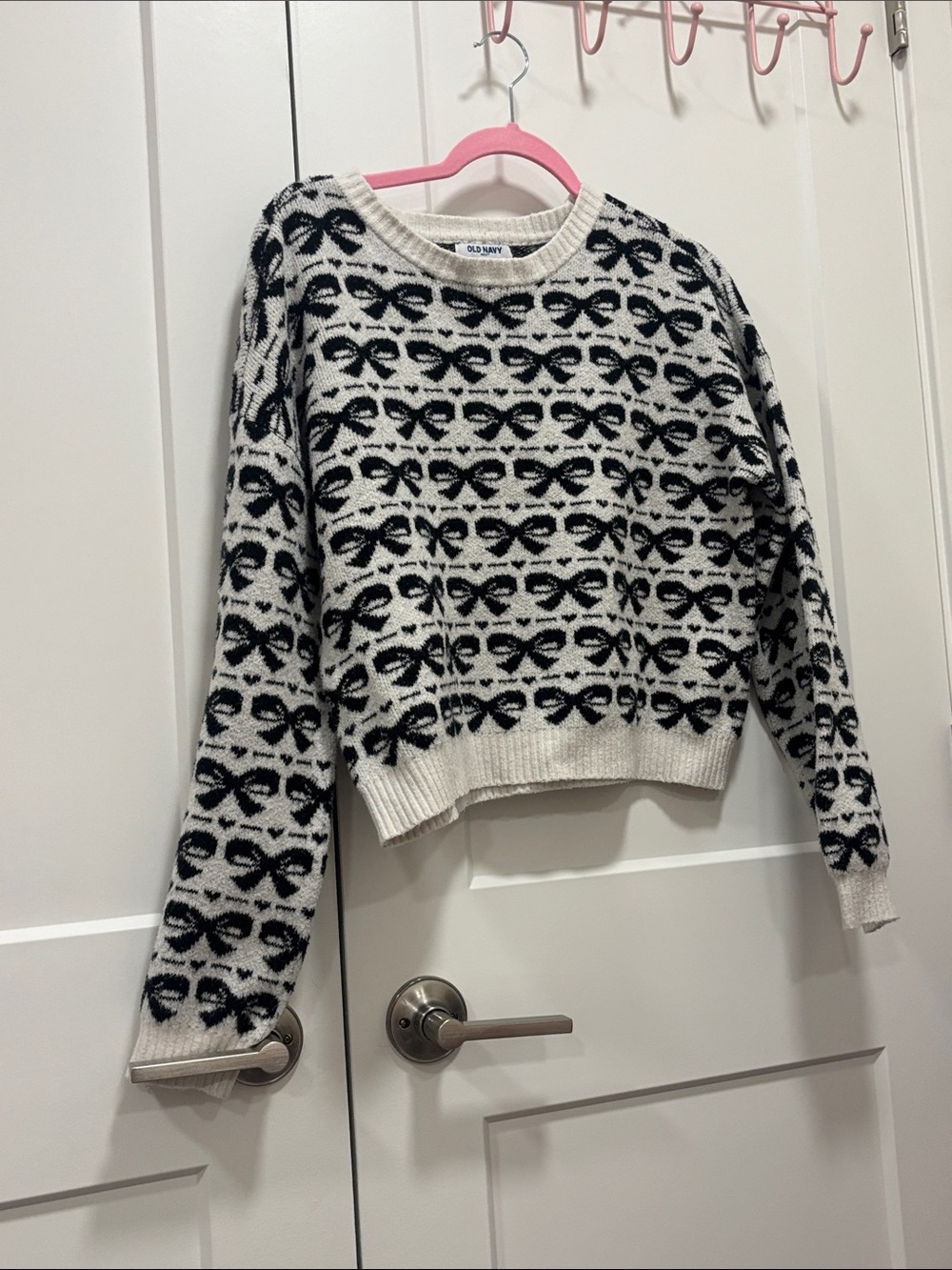 Old Navy Cream Sweater with Black Bow Motif